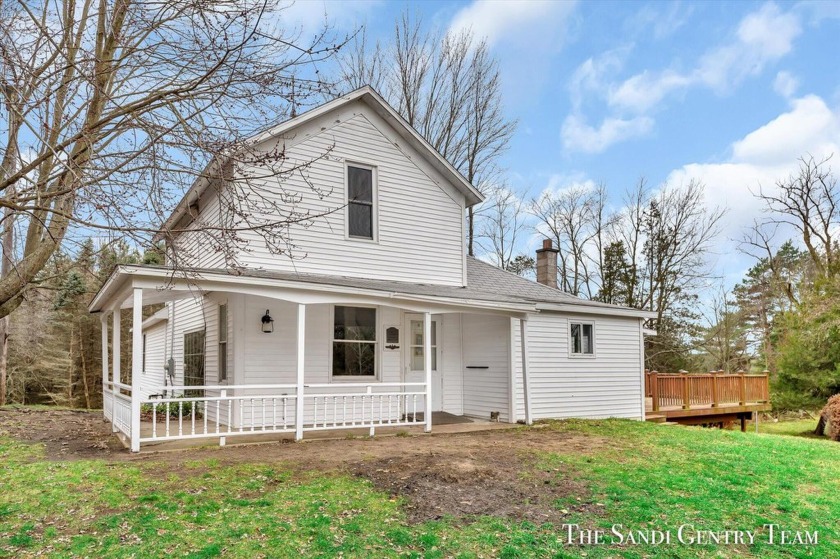 Discover the possibilities in this 2-bedroom, 2-bath home - Beach Home for sale in Spring Lake, Michigan on Beachhouse.com