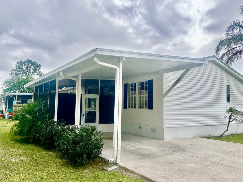 This charming 3-bedroom, 2-bath manufactured home situated in - Beach Home for sale in Bunnell, Florida on Beachhouse.com