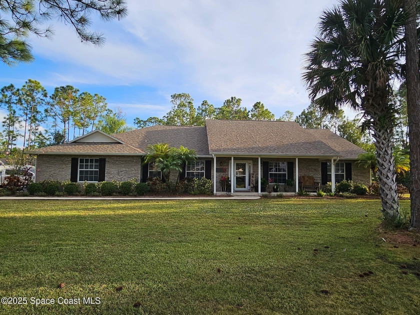 This lovingly maintained and updated 4 bedroom, 2.5 bath home in - Beach Home for sale in Mims, Florida on Beachhouse.com