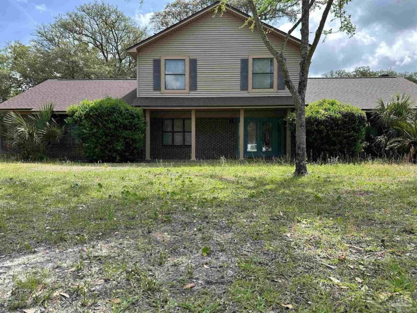 Step into this charming canal-front home, offering deeded water - Beach Home for sale in Milton, Florida on Beachhouse.com