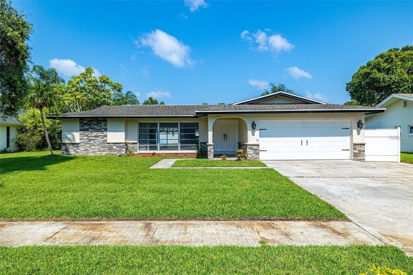 Welcome to this picture perfect pool home situated in an - Beach Home for sale in Clearwater, Florida on Beachhouse.com