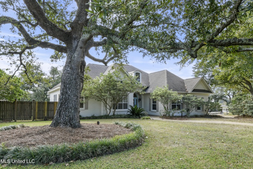 Set against the picturesque backdrop of Biloxi's serene - Beach Home for sale in Biloxi, Mississippi on Beachhouse.com