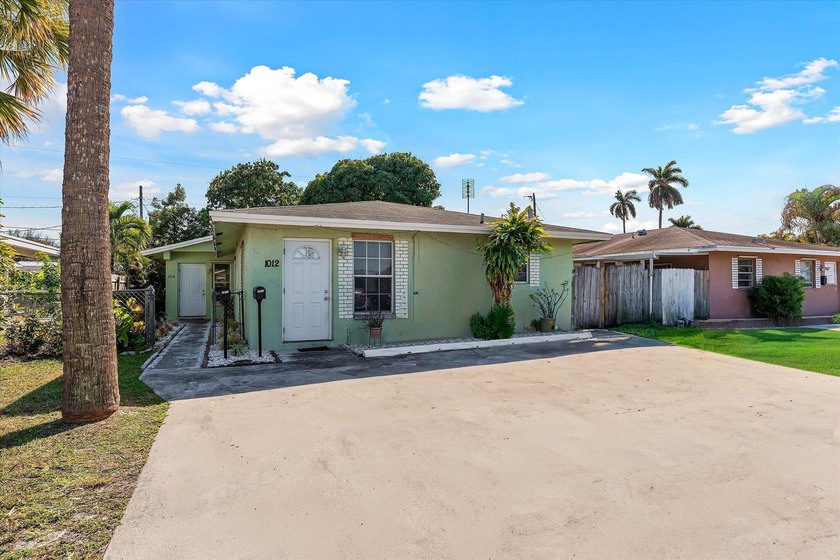 This versatile 2-bedroom, 1-bath property offers both - Beach Townhome/Townhouse for sale in West Palm Beach, Florida on Beachhouse.com
