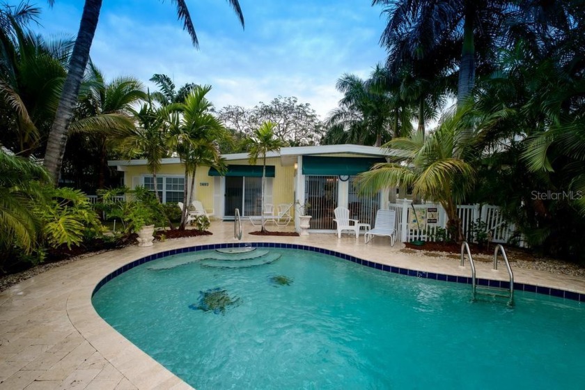 Charming Island home with beautiful landscaping and pool -- this - Beach Home for sale in Holmes Beach, Florida on Beachhouse.com