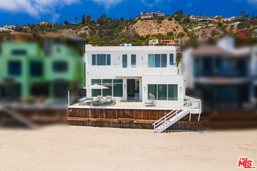With sunrise-to-sunset ocean and island views, this La Costa - Beach Home for sale in Malibu, California on Beachhouse.com
