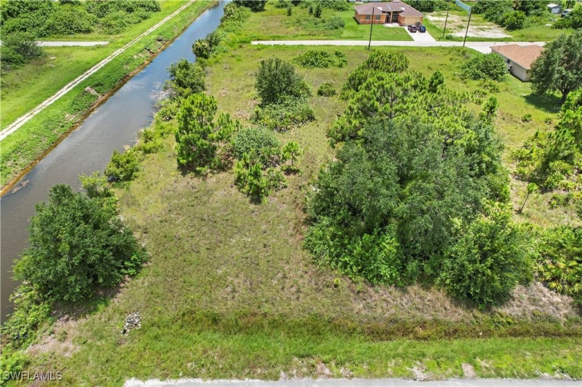 This prime piece of land offers a unique advantage with a canal - Beach Lot for sale in Lehigh Acres, Florida on Beachhouse.com