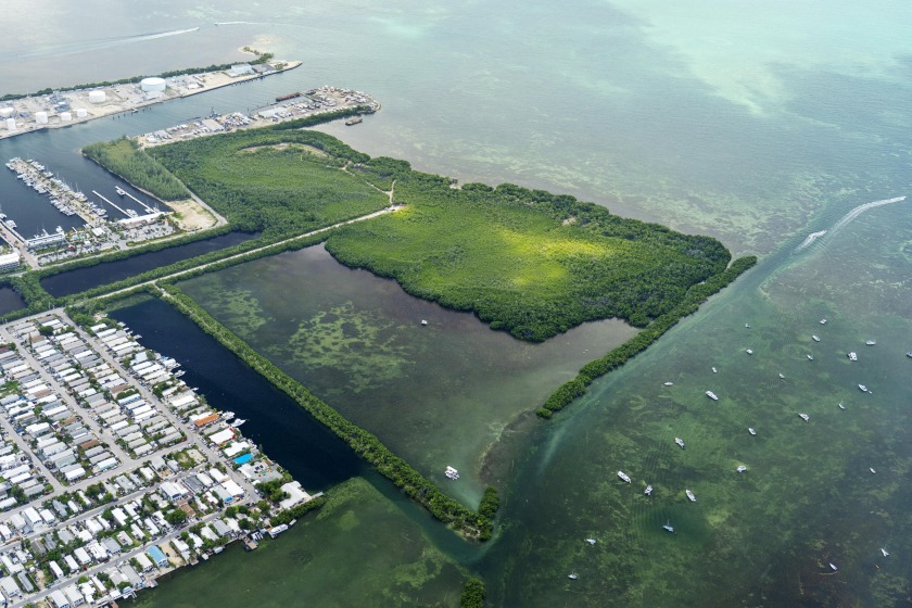 Nestled along the serene waterfront, these two picturesque - Beach Lot for sale in Key West, Florida on Beachhouse.com
