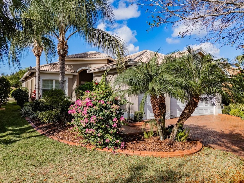 Florida friendly gardens set the tone as you arrive via a large - Beach Home for sale in Wimauma, Florida on Beachhouse.com