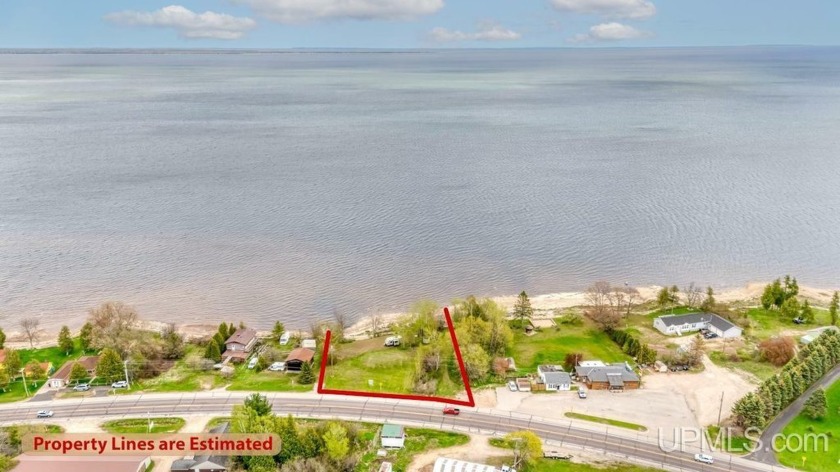 Enjoy the waves washing against the shoreline with a soft - Beach Lot for sale in Escanaba, Michigan on Beachhouse.com