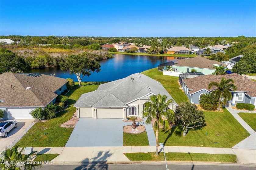 Discover serene lakeside living in this inviting 4-bedroom - Beach Home for sale in Rockledge, Florida on Beachhouse.com