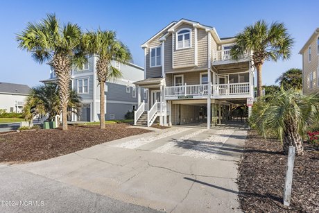 Welcome to your dream beach home! This 2200-square-foot oasis - Beach Home for sale in Holden Beach, North Carolina on Beachhouse.com