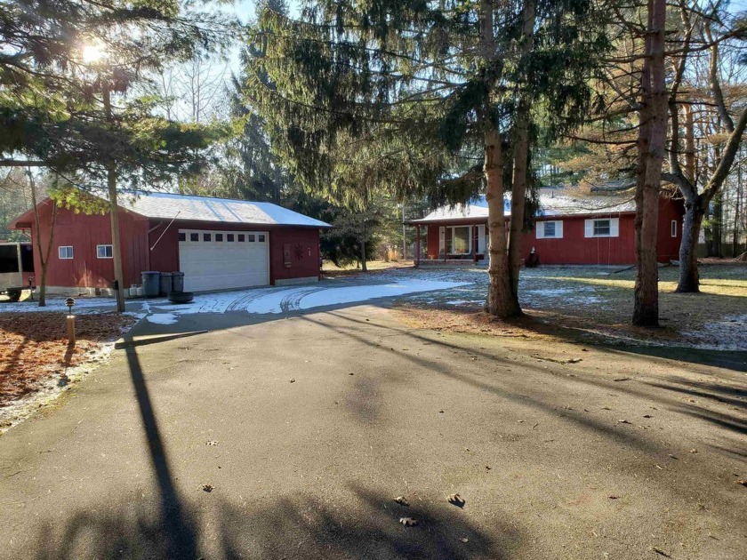 Nestled in a nicely treed 1.2 acre lot, this location on Old - Beach Home for sale in Burtchville, Michigan on Beachhouse.com