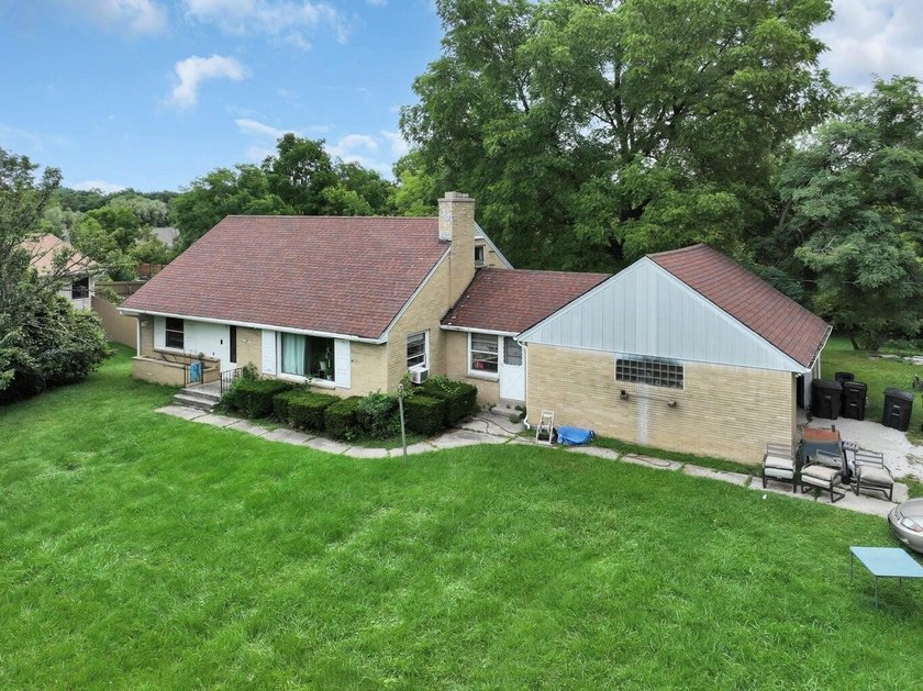 Set on 3.5 acres in desirable Greenfield, this beautiful - Beach Home for sale in Greenfield, Wisconsin on Beachhouse.com