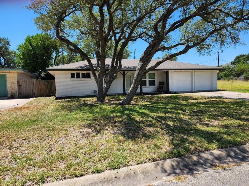 Nestled on a tree-shaded lot, this charming home features many - Beach Home for sale in Rockport, Texas on Beachhouse.com