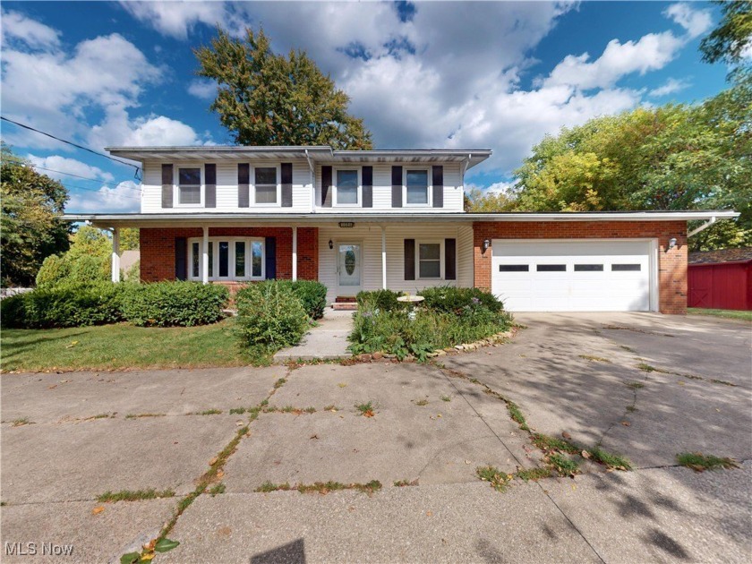 Perched on a gentle hill, this stately Colonial offers the - Beach Home for sale in Geneva, Ohio on Beachhouse.com