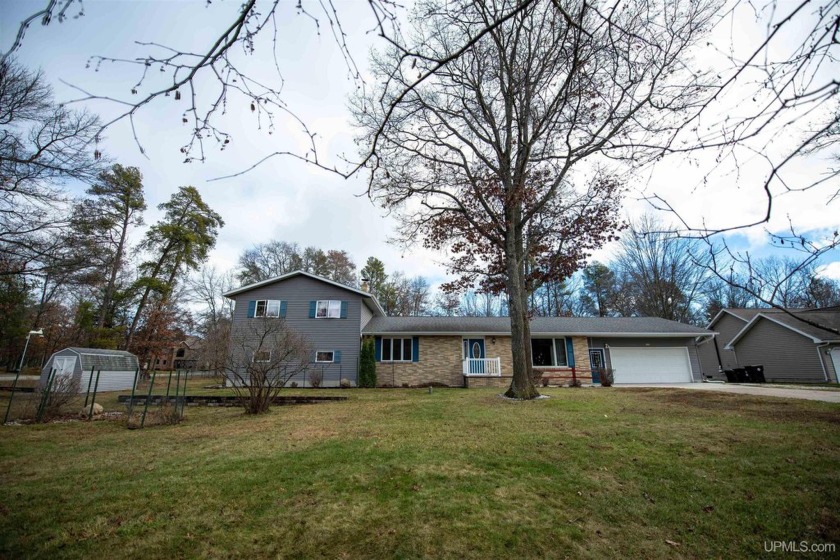 This captivating home on the bluff in Gladstone, located under - Beach Home for sale in Escanaba, Michigan on Beachhouse.com