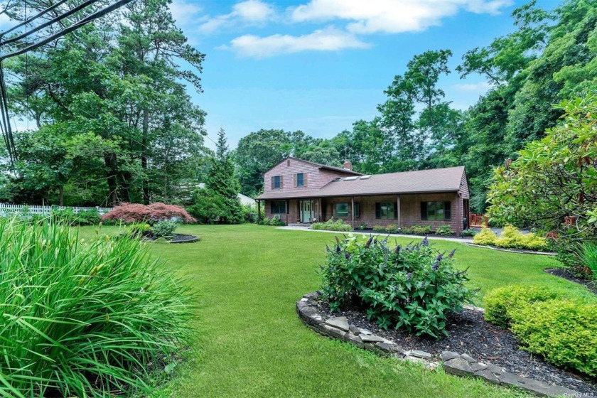 Welcome to this charming Cedar Shake Colonial nestled in a - Beach Home for sale in Ridge, New York on Beachhouse.com