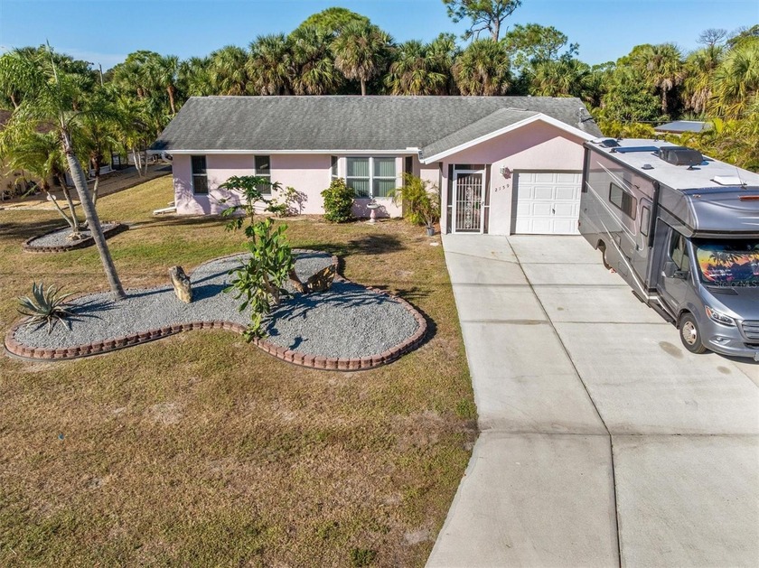 Situated on the Auburn Waterway, with a private dock and a boat - Beach Home for sale in Port Charlotte, Florida on Beachhouse.com