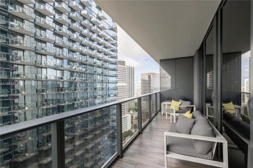 Discover luxury living in this immaculate 1 bedroom + Den - Beach Condo for sale in Miami, Florida on Beachhouse.com