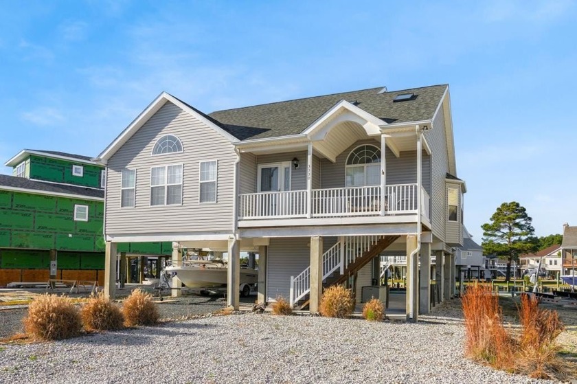 Waterfront house with paved area underneath and nice landscaping - Beach Home for sale in Greenbackville, Virginia on Beachhouse.com