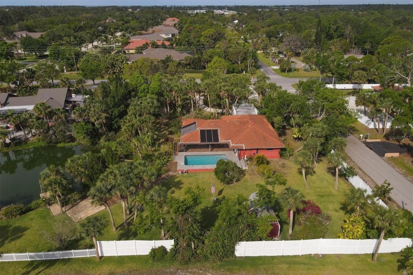 Enjoy over 200 feet of lakefront Florida living at its finest! - Beach Home for sale in Nokomis, Florida on Beachhouse.com
