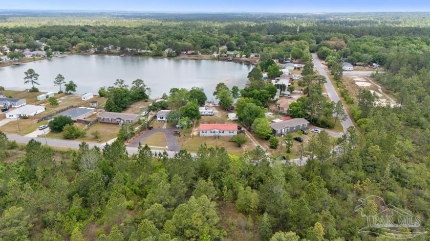 Twin Lake Estate Lakefront Living Awaits! Discover your perfect - Beach Home for sale in Milton, Florida on Beachhouse.com