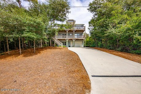 Nestled in the tree tops, this immaculate, well maintained home - Beach Home for sale in Emerald Isle, North Carolina on Beachhouse.com