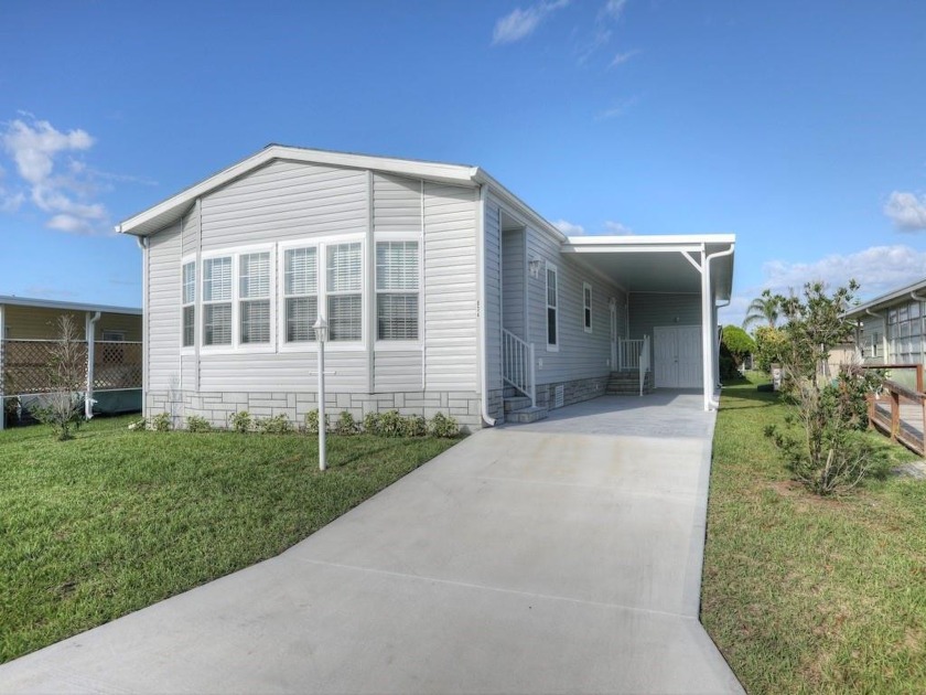 Brand New Model! Walk to pool # 2. LVP flooring throughout with - Beach Home for sale in Barefoot Bay, Florida on Beachhouse.com