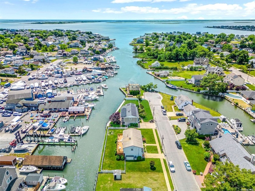 Welcome to this Waterfront Hi-Ranch with 99' of Bulkheading - Beach Home for sale in Massapequa, New York on Beachhouse.com