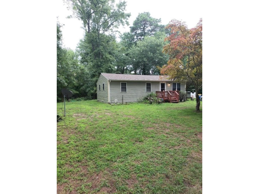 This three bedroom house sits on a .46 double lot. Own a nice - Beach Home for sale in Chincoteague Island, Virginia on Beachhouse.com