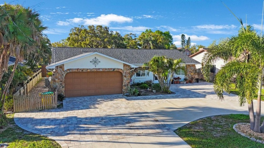 Welcome to your dream home on Lake Tarpon, nestled in a serene - Beach Home for sale in Palm Harbor, Florida on Beachhouse.com