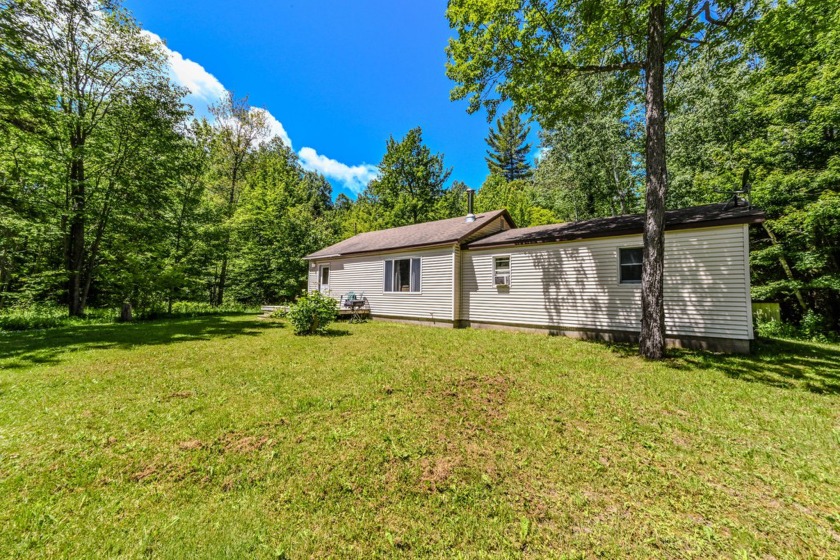 This cozy and cute home is on a beautifully wooded almost 8 acre - Beach Home for sale in Cheboygan, Michigan on Beachhouse.com