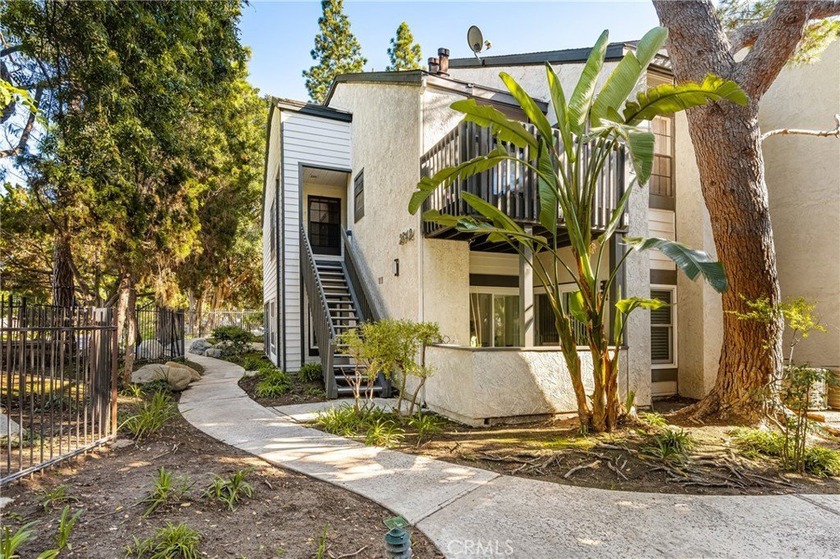 Highly renovated ground-level end unit in the prestigious gated - Beach Condo for sale in Santa Ana, California on Beachhouse.com
