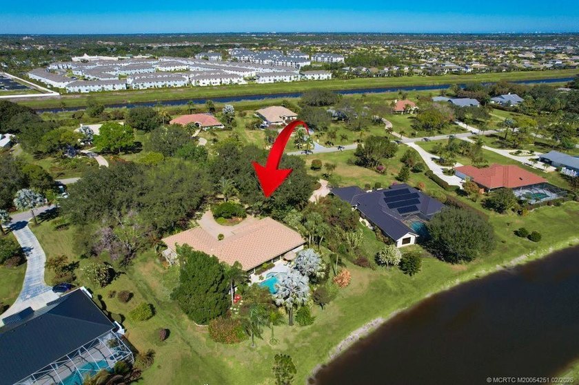 Located within the 24-hour manned, gated Evergreen Club, this - Beach Home for sale in Palm City, Florida on Beachhouse.com