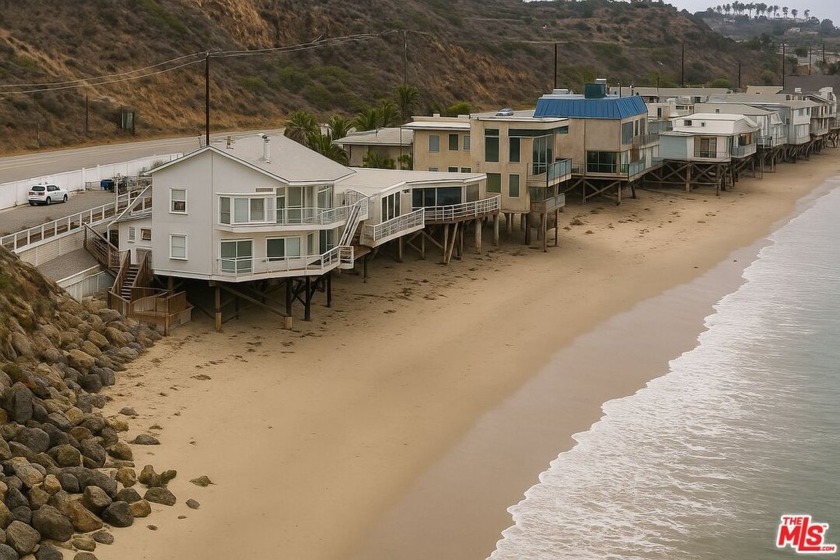 This beach house sits right on the sand, where floor-to-ceiling - Beach Home for sale in Malibu, California on Beachhouse.com
