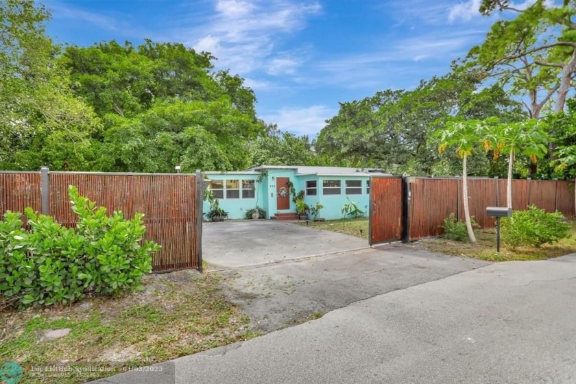 Imagine your own Tropical Mini Estate... This gated home, easily - Beach Home for sale in Pompano Beach, Florida on Beachhouse.com