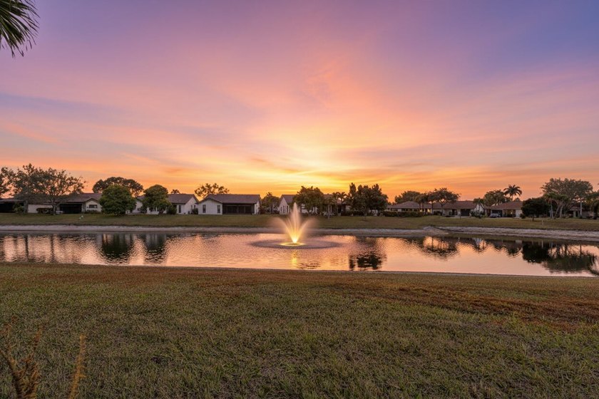 Relaxing direct lakefront with a sparkling lighted fountain view - Beach Home for sale in Greenacres, Florida on Beachhouse.com