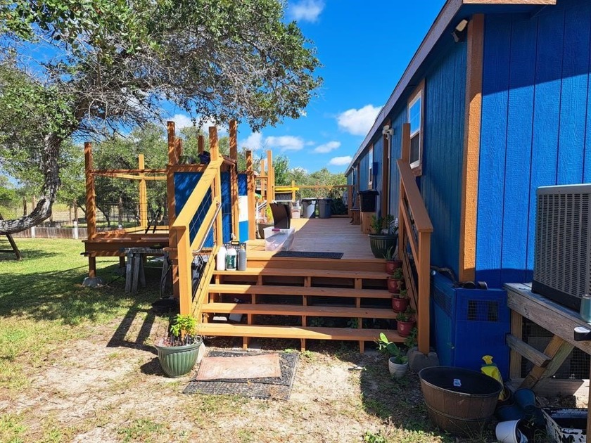 Located on 5 lovely cared for acres, this is a double wide - Beach Home for sale in Aransas Pass, Texas on Beachhouse.com
