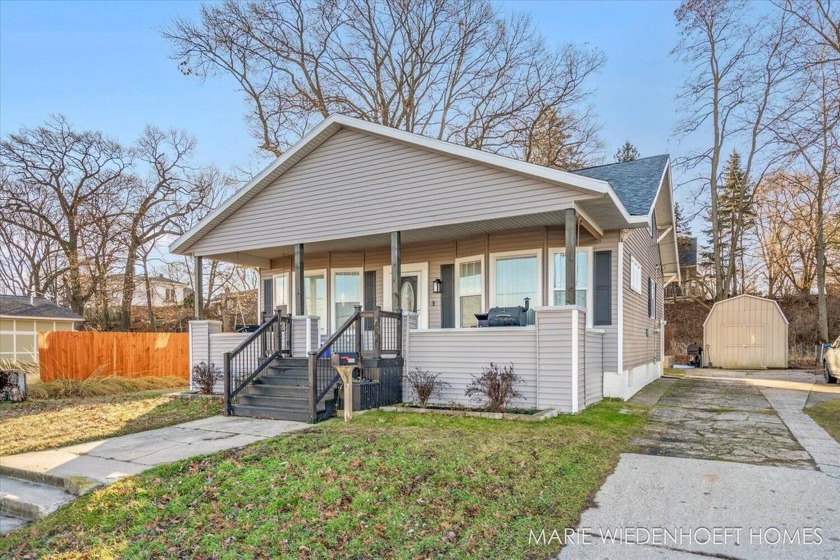 Step into this beautifully restored gem, where timeless - Beach Home for sale in Muskegon, Michigan on Beachhouse.com