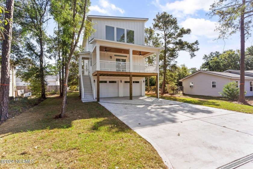 Discover coastal living at its finest at 126 S Middleton Ave - Beach Home for sale in Oak Island, North Carolina on Beachhouse.com