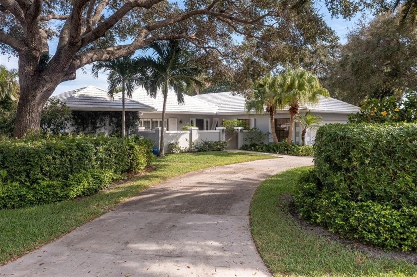 Beautiful corner lot home, lakefront with a screened-in pool in - Beach Home for sale in Vero Beach, Florida on Beachhouse.com