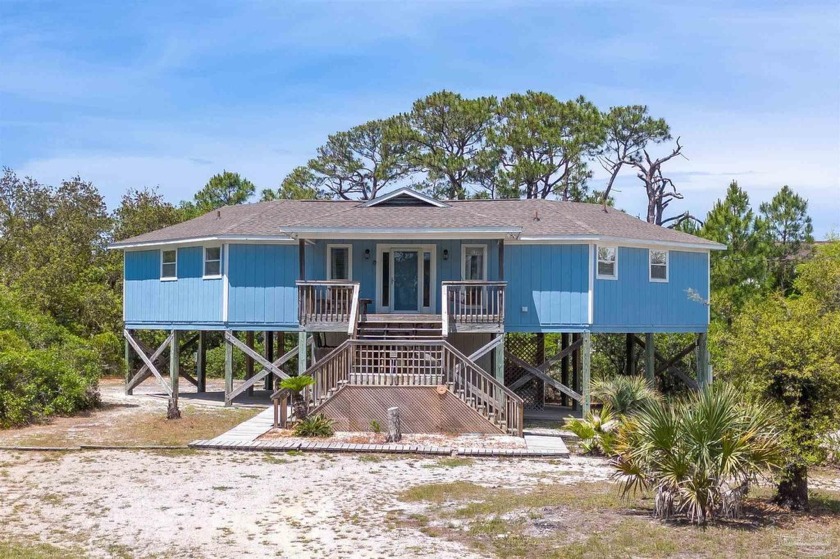 This CHARMING beach cottage offers comfort, seclusion  income - Beach Home for sale in Gulf Shores, Alabama on Beachhouse.com