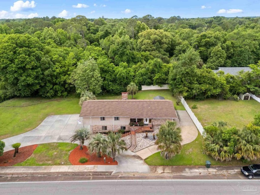 Mid-Century Modern meets natural serenity in this charming - Beach Home for sale in Milton, Florida on Beachhouse.com