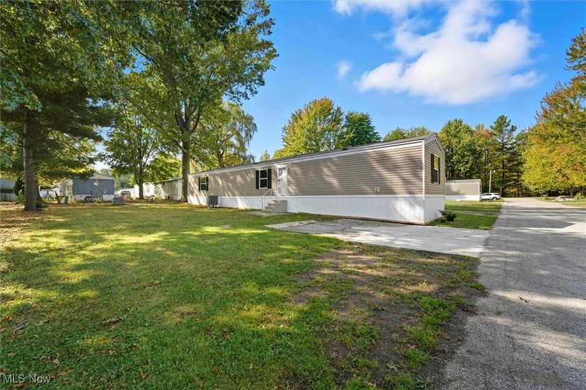 Welcome to your brand-new home in the inviting Austin Woods - Beach Home for sale in Geneva, Ohio on Beachhouse.com