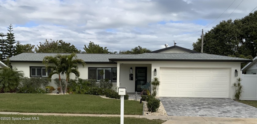 Stunning beachside haven! This renovated 4-bed, 2-bath home - Beach Home for sale in Indian Harbour Beach, Florida on Beachhouse.com