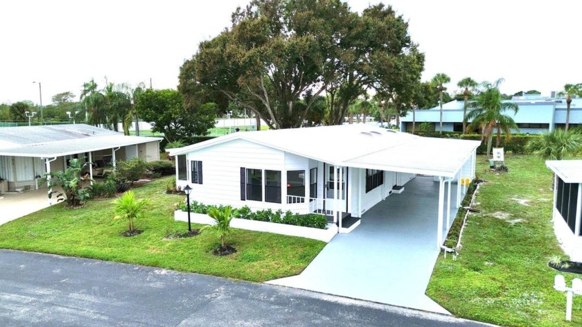 Welcome to this impeccably renovated home, where modern elegance - Beach Home for sale in Boynton Beach, Florida on Beachhouse.com