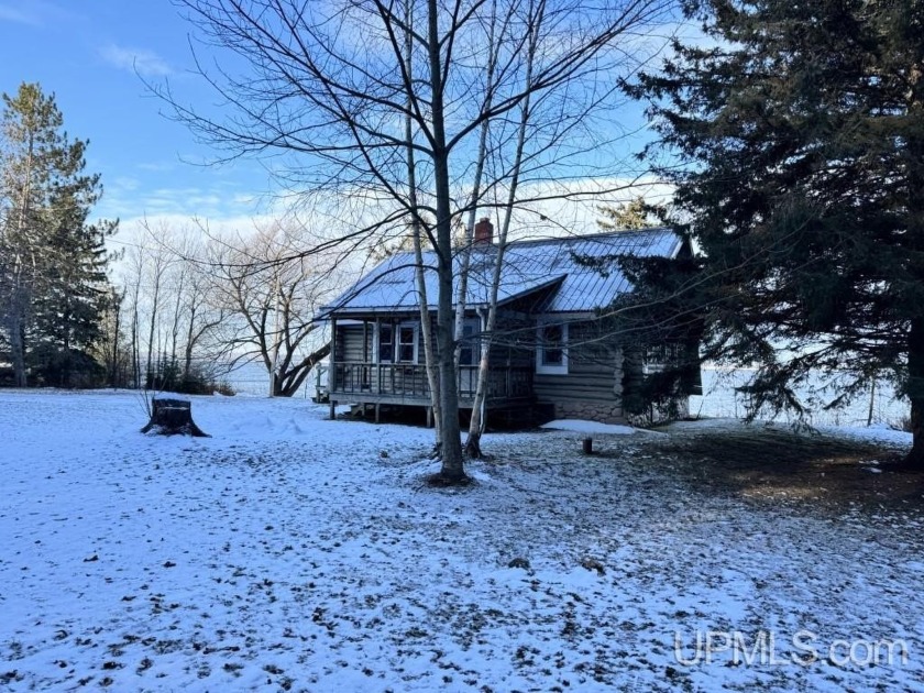 Charming lakefront log cottage with 210' of stunning Lake - Beach Home for sale in L Anse, Michigan on Beachhouse.com