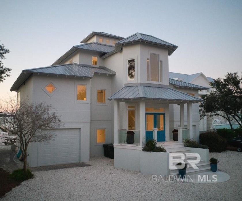 This gorgeous waterfront home is often admired as one of the - Beach Home for sale in Orange Beach, Alabama on Beachhouse.com