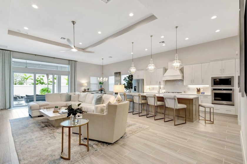 This Stylish home greets you with a covered porch and a - Beach Home for sale in Palm Beach Gardens, Florida on Beachhouse.com