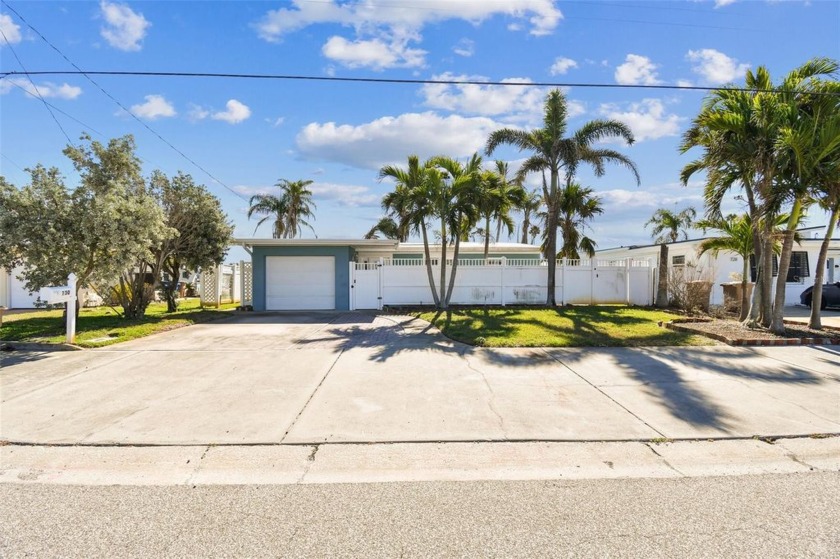 This inviting two-bedroom, one-bathroom home boasts an - Beach Home for sale in Madeira Beach, Florida on Beachhouse.com